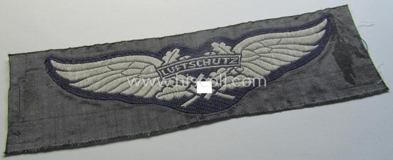 Attractive - and scarcely encountered! - EM- (ie. NCO-) pattern, so-called: 'Luftschutz' (ie. RLB-) breast-badge (ie. 'Brustabzeichen') as executed in so-called: 'BeVo'-weave-pattern and that comes in a 'virtually mint- ie. unissued' condition