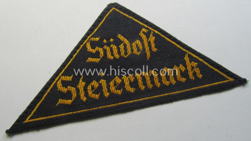 Superb, 'HJ' ('Hitlerjugend') district-triangle (ie. 'Gebietsdreieck') entitled: 'Südost Steiermark' (being a hardly used- nor worn example that still retains its period-attached 'RzM'-etiket)