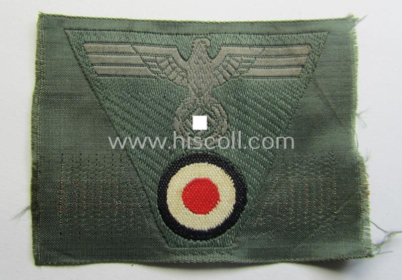 WH (Heeres) so-called: 'M43-pattern') cap-eagle/cocarde (ie. cap-trapezoid) as was specifically produced for usage on the so-called: 'M-43'-model field-caps (ie. 'Einheitsfeldmützen')