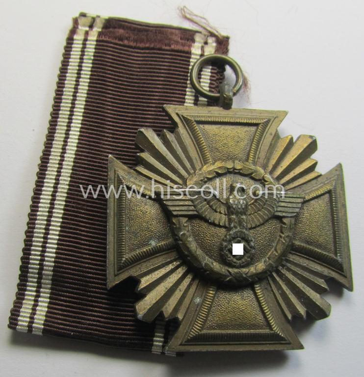 Attractive, 'N.S.D.A.P. Dienstauszeichnung in Bronze' (ie. being of the '3. Stufe für 10 Jahre treue Dienste') being a non-maker-marked- (and so-called: 'heavy-weight'!) example that comes together with its period ribbon (ie. 'Bandabschnitt')
