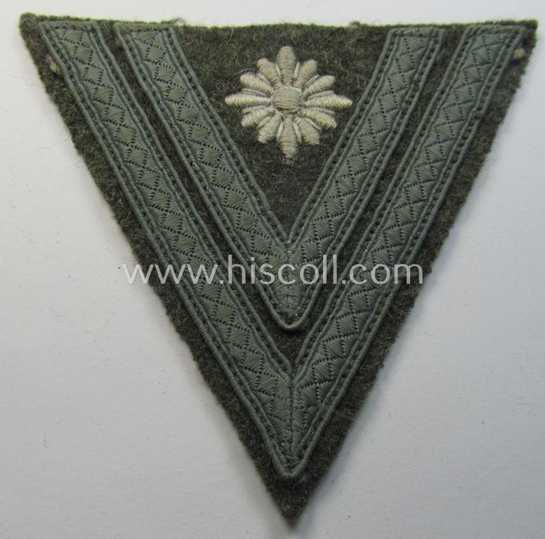 Attractive, WH (Heeres) 'Armwinkel' (or: arm-chevron) as executed on typical field-grey-coloured wool as was specifically intended for usage by a soldier with the (unusually encountered!) rank of: 'Stabsgefreiter'