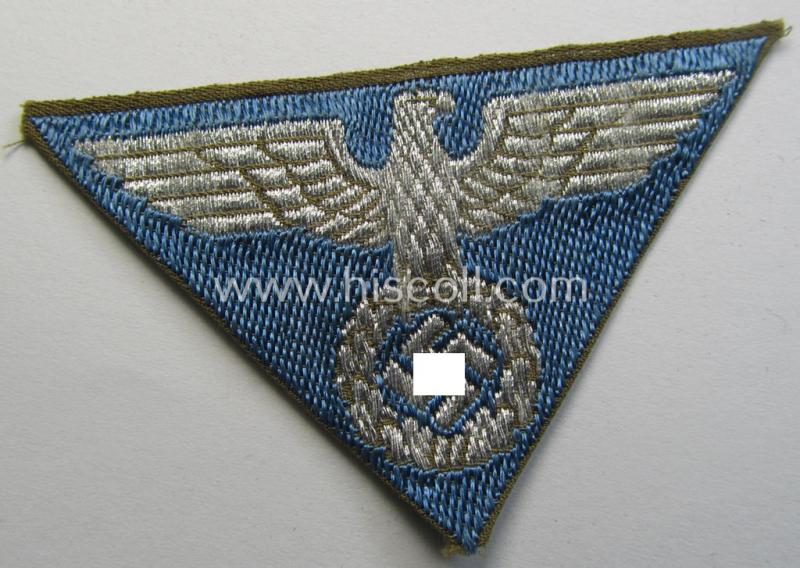 Attractive, SA-related cap-eagle as was intended for the: 'Lagermütze' (ie. side-cap) being an example as woven on a bright-blue-coloured background and as such intended for members within the: 'SA-Gruppe Warthe o. Oberrhein'