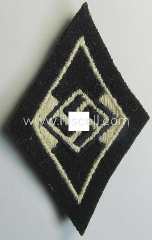Waffen-SS-pattern, machine-embroidered and/or black- and white-coloured sleeve-insignia (ie. 'Ärmelraute') depicting a so-called: 'HJ-Raute' as was used and intended to signify former membership within the 'Hitlerjugend'