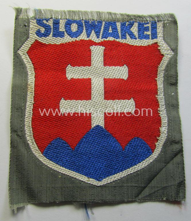Attractive - albeit minimally damaged! - 'BeVo'-type armshield entitled: 'Slowakei' (being a piece that was intended for a volunteer who served within the: 'Deutsche Wehrmacht' ie. within the: 'Slowakisches Legion')