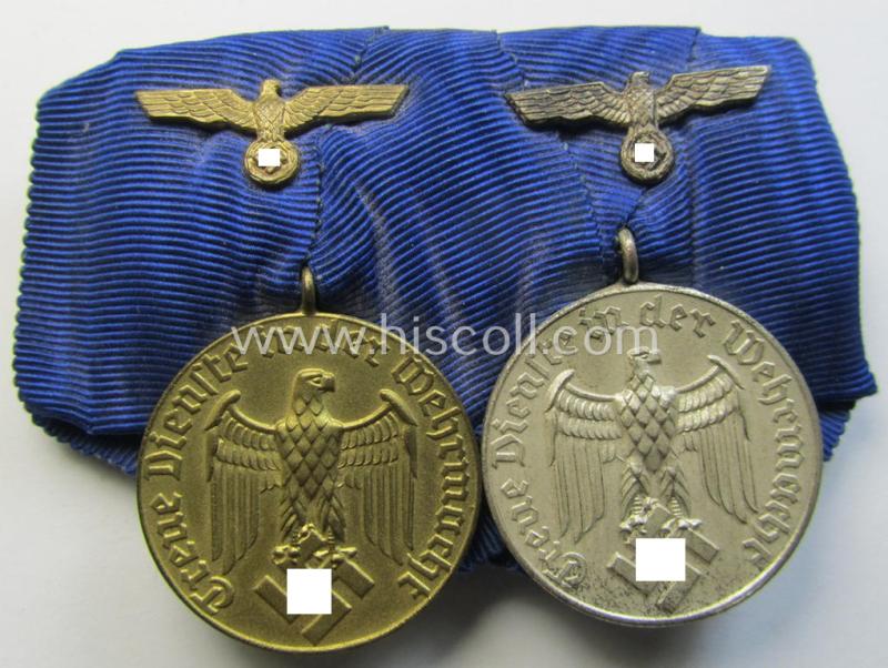 Attractive, two-pieced medal-bar (ie. 'Spange') showing two: WH (Heeres o. Kriegsmarine) so-called: 'Dienstauszeichnungen für 4 u. 12 Jahre Treue Dienste' that both come period-mounted as a so-called: 'Doppelspange'