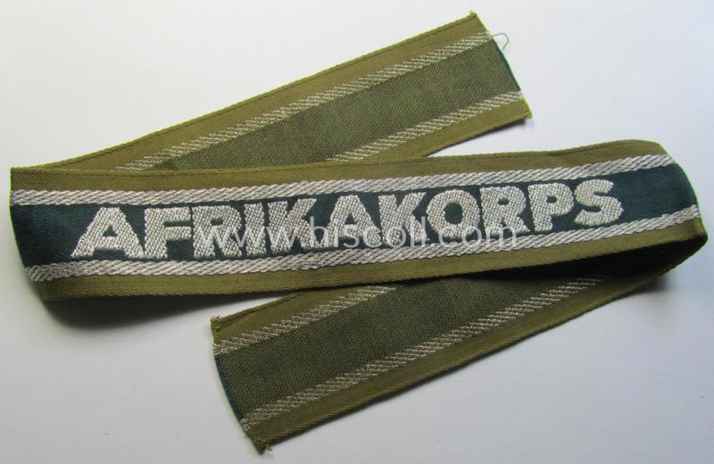 Superb, 'BeVo'-like cuff-title (ie. 'Ärmelstreifen') entitled: 'Afrikakorps' being a presumably issued but never worn example that comes in an overall very nice- (ie. non-shortened- and never tunic-attached-), condition