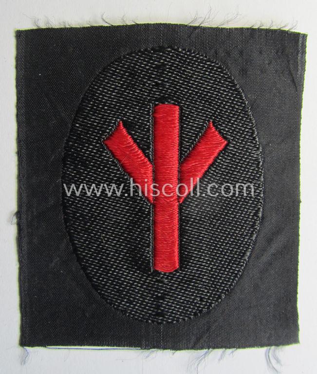 Superb - and never used- nor worn! - N.S.K.K.- (ie. 'National-Socialistisches Kraftfahr-Korps'-) related armbadge as was intended for an: 'N.S.K.K.-Sanitäts-Unterführer o. Mann' (ie. 'Feldscher') that still retains its 'RzM'-etiket