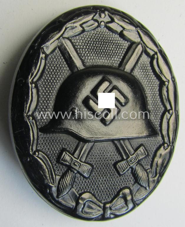 Neat, dual-maker- (ie. 'E.H.'- and/or: '126'-) marked example of a black-class wound-badge (or: 'Verwundeten-Abzeichen in Schwarz') being an example that was produced by the maker (ie. 'Hersteller') named: 'Eduard Hahn'