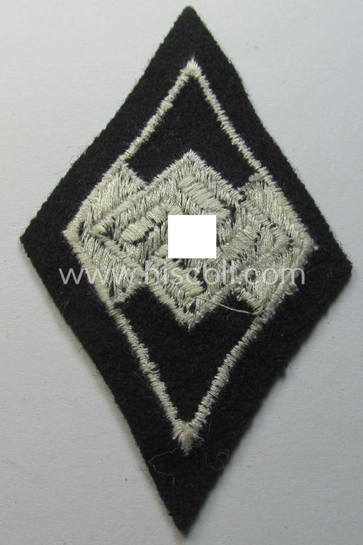 Attractive, Waffen-SS-pattern and machine-embroidered and/or black- and white-coloured sleeve-insignia (ie. 'Ärmelraute') depicting a so-called: 'HJ-Raute' as was used and intended to signify former membership within the 'Hitlerjugend'