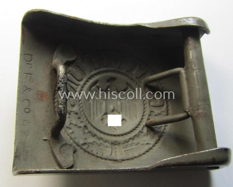 Superb, WH (Heeres) field-grey-coloured- and/or steel-based belt-buckle being a clearly maker- (ie. 'Dr. F. & Co.') marked- and/or: '1942'-dated example that comes in an overall wonderful- (ie. 'virtually mint'), condition