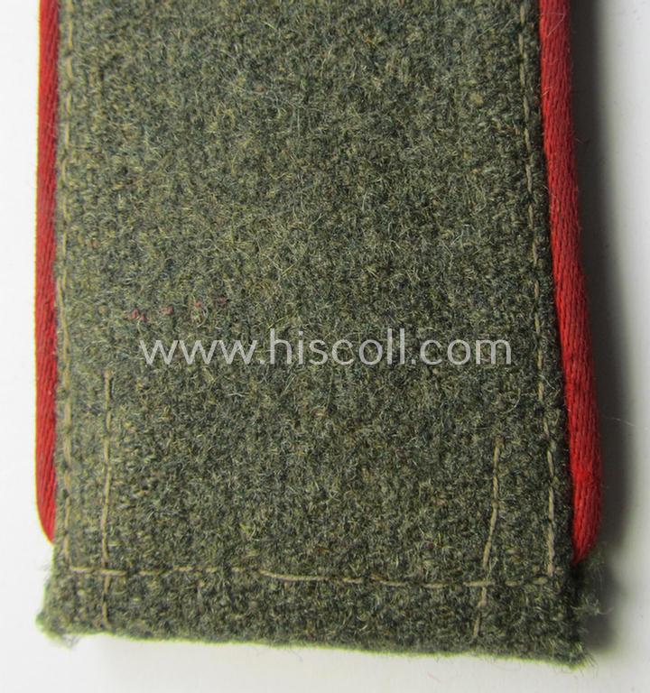 Attractive - albeit clearly used and regrettably single! - WH (Heeres) 'M43'-pattern, EM-shoulderstrap as was intended for usage by a: 'Soldat eines (Sturm-)Artillerie-Abteilungs o. Regiments'