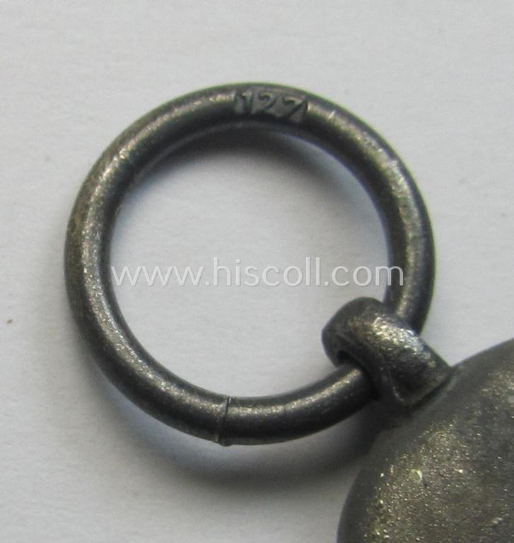 Attractive medal-set: 'Winterschlacht im Osten 1941-42' being a maker- (ie. '127'-) marked- (and/or 'Feinzink'-based) specimen by the maker: 'Moritz Hausch A.G.' and that comes together with its (non-confectioned) ribbon (ie. 'Bandabschnitt')