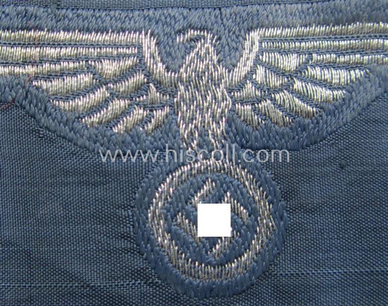 Superb, BZP (ie. 'Bahnschutz-Polizei') officers'-/ie. NCO-type side-cap- (ie. 'Schiffchen'-) eagle as woven in 'flat-wire-BeVo'-style and executed in bright-silver thread on a greyish-blue-coloured and linnen-based background