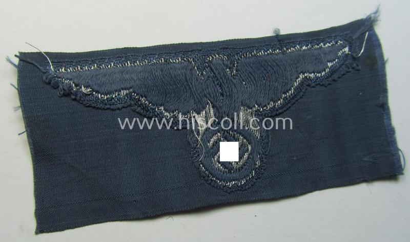 Superb, BZP (ie. 'Bahnschutz-Polizei') officers'-/ie. NCO-type side-cap- (ie. 'Schiffchen'-) eagle as woven in 'flat-wire-BeVo'-style and executed in bright-silver thread on a greyish-blue-coloured and linnen-based background