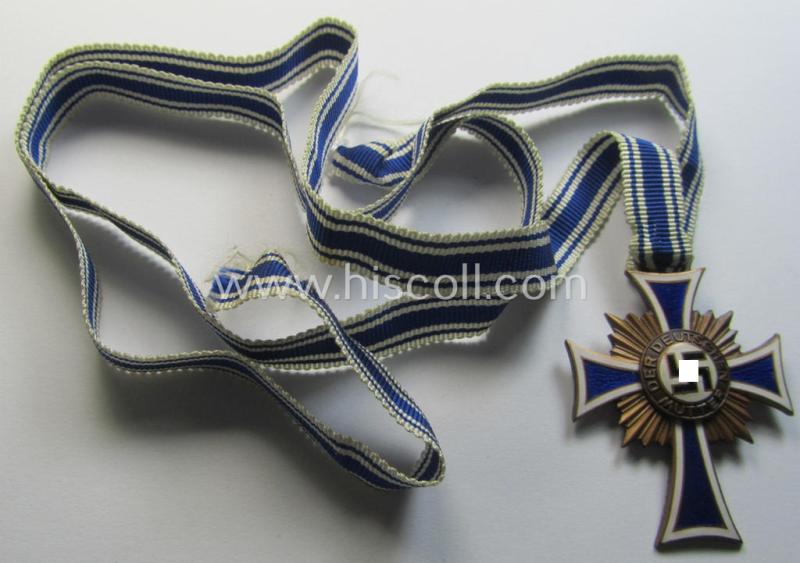 Neat, 'Ehrenkreuz der deutschen Mutter - dritte Stufe' being a non-maker-marked example that comes mounted onto its (large-sized!) ribbon and that comes in an overall very nice- (albeit minimally worn- ie. used-), condition