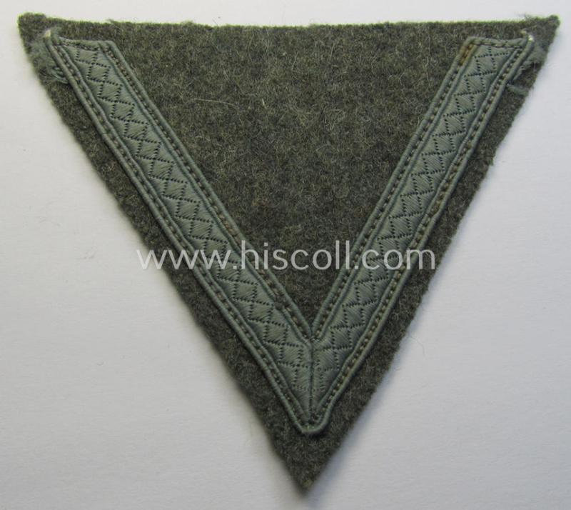 WH (Heeres) 'Armwinkel' (or: arm-chevron) as executed on typical field-grey-coloured wool as was specifically intended for usage by a soldier with the rank of: 'Gefreiter'