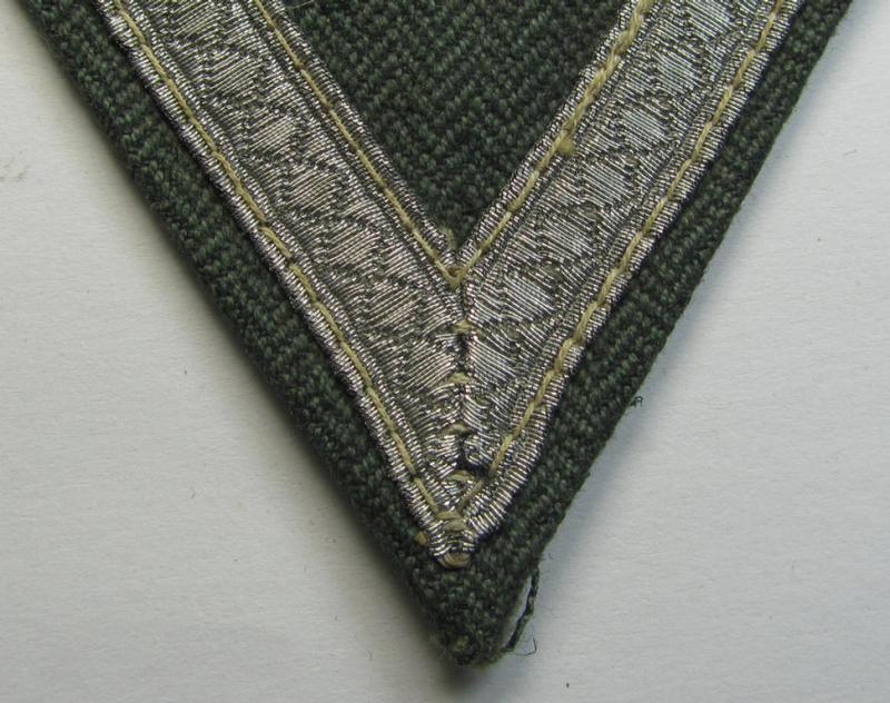 WH (Heeres ie. Waffen-SS) 'Armwinkel' (or: arm-chevron) as was executed on a greenish-coloured- and/or 'HBT'-like- (ie. 'Drillich'-) based background as was intended for usage by a: 'Gefreiter' (ie. 'SS-Sturmmann')