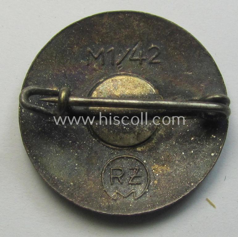 Neat - bright-red-coloured and nicely preserved! - 'N.S.D.A.P.'-membership-pin- ie. party-badge (or: 'Parteiabzeichen') which is maker-marked on its back with the makers'-designation: 'RzM' and/or: 'M1/42'