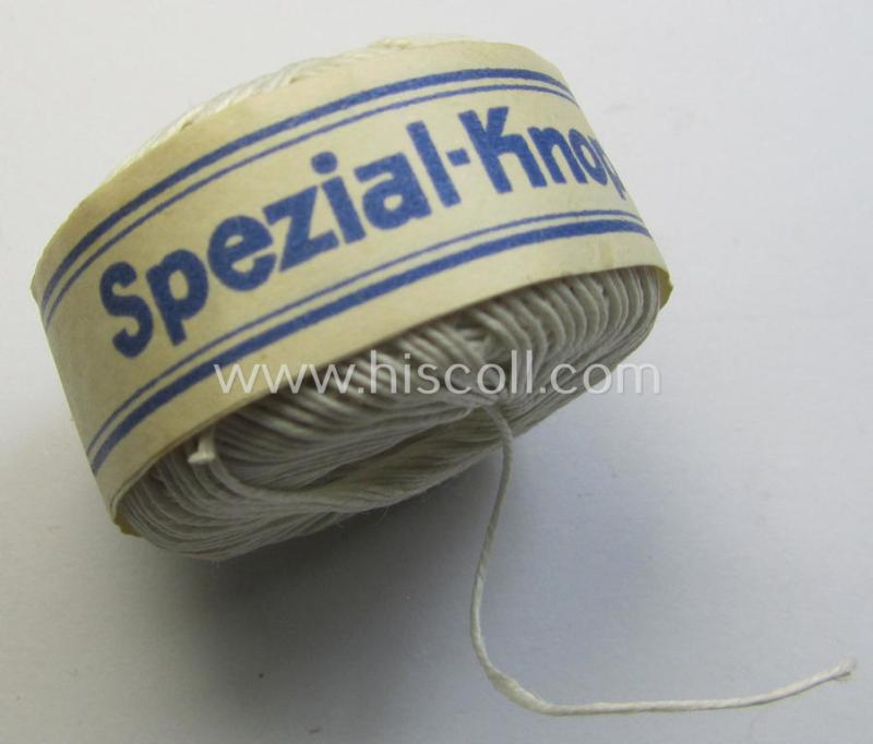 Neat, spare- or soldiers' personal-equipment-item: an unused roll of WH-period stitching-thread holding 50 mtrs. of white-coloured linnen named: 'Spezial Knofzwirn Nr. 30' as was produced by a company named: 'AAK'