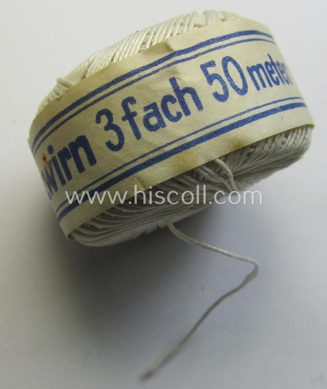 Neat, spare- or soldiers' personal-equipment-item: an unused roll of WH-period stitching-thread holding 50 mtrs. of white-coloured linnen named: 'Spezial Knofzwirn Nr. 30' as was produced by a company named: 'AAK'