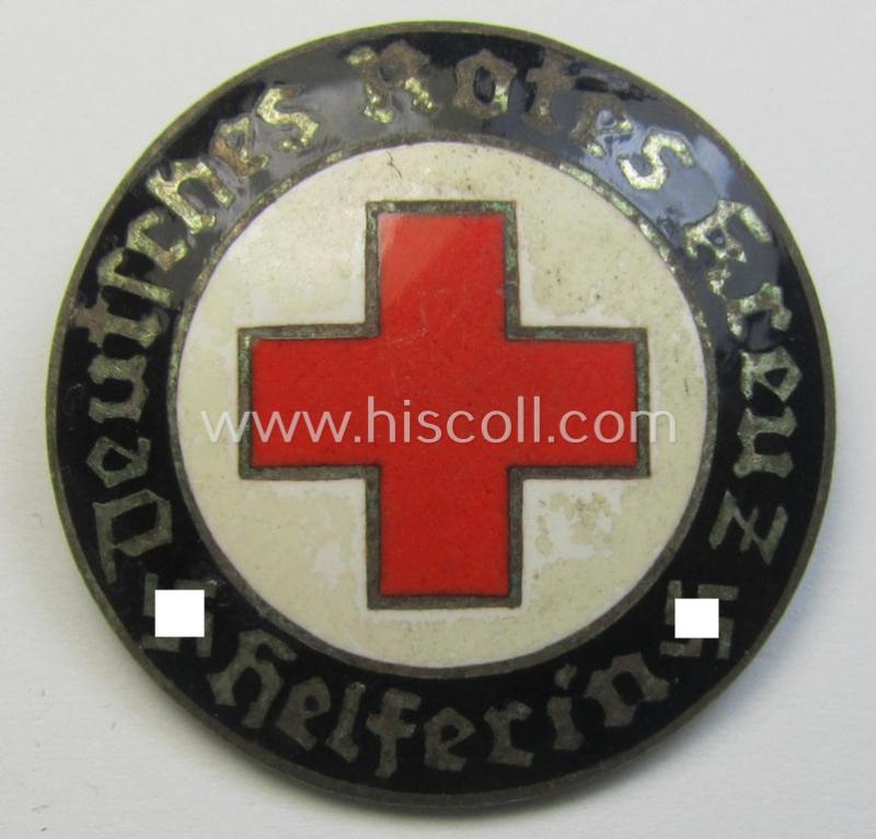 Attractive - and just moderatelty used! - example of a DRK (ie. 'Deutsches Rotes Kreuz' or German Red Cross) nurses'-badge as was intended for a: 'Helferin' being a maker- (ie. 'E.L.M.'-) marked example that comes in a fully untouched condition