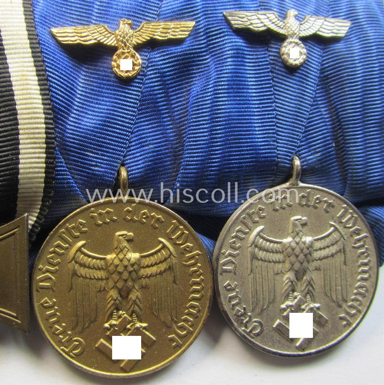 Attractive, 3-pieced medal-bar (ie. 'Ordenspange') showing resp. a WWI-period: 'FKK 1914-18 ohne Schw.' and two WWII-period: WH (Heeres or KM) so-called: 'Dienstauszeichnungen für 4 u. 12 Jahre Treue Dienste'