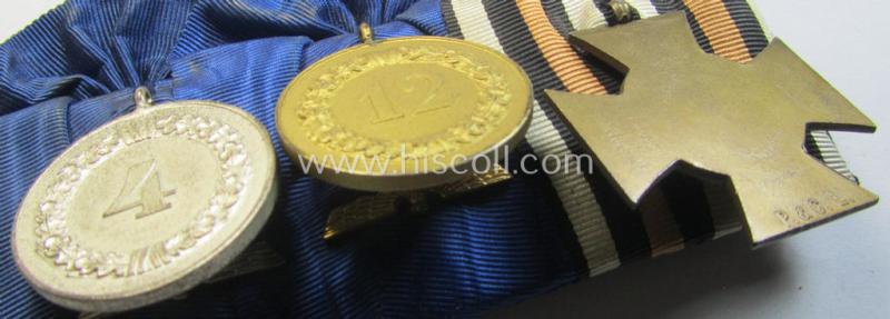 Attractive, 3-pieced medal-bar (ie. 'Ordenspange') showing resp. a WWI-period: 'FKK 1914-18 ohne Schw.' and two WWII-period: WH (Heeres or KM) so-called: 'Dienstauszeichnungen für 4 u. 12 Jahre Treue Dienste'