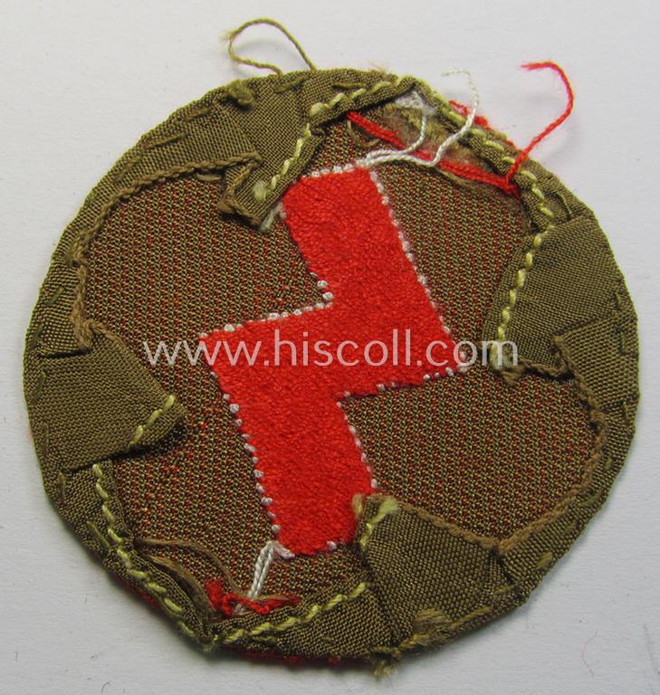 DJ (ie. 'Deutsches Jungvolk') arm-badge as was specifically intended for usage by a member who served within the: 'Oberbann 1' (being a moderately used- and carefully shirt-removed example that is void of an 'RzM'-etiket)