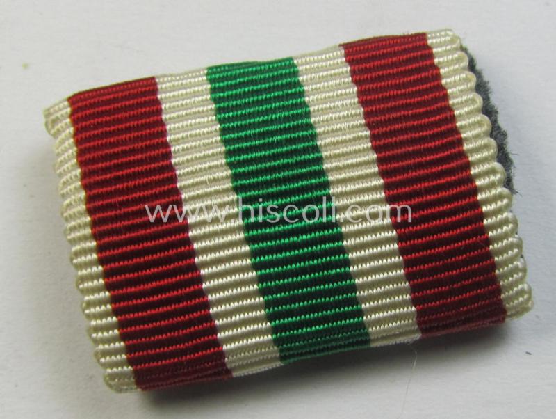 Single-pieced - and actually scarcely found! - WH (Heeres, LW etc.) ribbon-bar (ie. 'Band- o. Feldspange') showing the ribbon for a WH Memel- (ie. 'Memelland'-) 'Anschluss'- (ie. occupation-) medal: '22 März 1939'