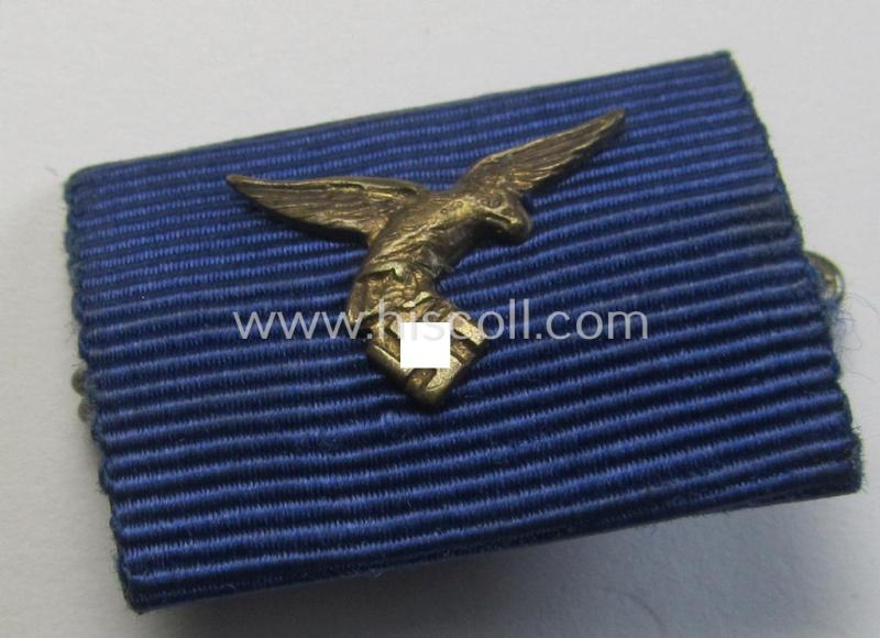 Single-pieced, WH (Luftwaffe) related ribbon-bar (ie. 'Feld-/Bandspange') showing the ribbon for a: 'WH (LW) Dienst-Auszeichnung der 3. Stufe' (and having a neat 'down-tailed' eagle-device attached)