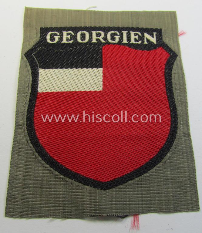 Attractive, 'BeVo'-type armshield entitled: 'Georgien' (being a 'virtually mint- ie. unissued' example as intended for a volunteer who served within the 'Deutsche Wehrmacht' ie. within the 'Georgisches Legion')