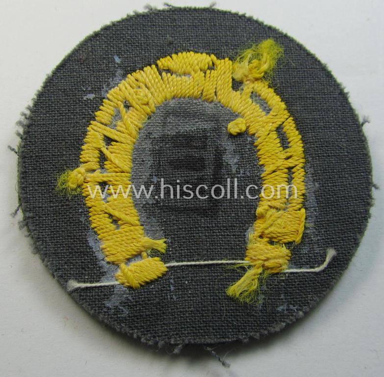 WH (Heeres) so-called trade- and/or special-career arm-patch as specifically intended for a: 'Hufbeschlagmeister' (or: farrier) being a neatly hand-embroidered 'variant' as executed on field-grey-coloured wool