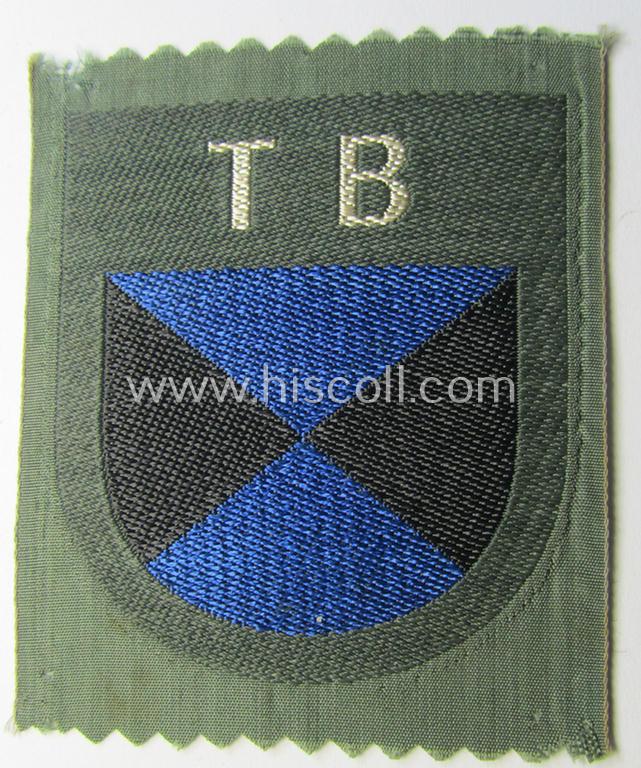 Eastern- ie. Russian volunteer (ie. Cossack-) related armshield as executed in the neat 'BeVo'-weave pattern depicting the interwoven 'Cyrillic' characters: 'TB' (as was intended for the Russian volunteers serving within the 'Terek Cossacks')