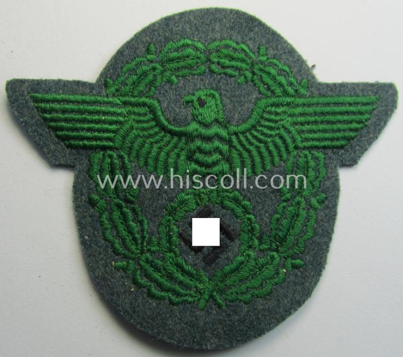 Attractive - and simply never used- nor worn! - Police- (ie. 'Polizei'- ie. 'Gendarmerie'-) related machine-embroidered-pattern arm-eagle, as executed in bright-green-coloured linnen on a typical 'Polizei'-coloured- and/or woolen-based, background