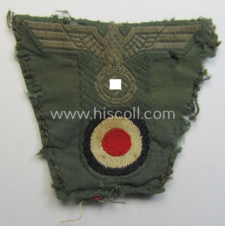 WH (Heeres) 'T-shaped' M42-model cap-eagle/cocarde as executed in 'BeVo'-weave pattern (being a minimally stained example that comes in a clearly used- ie. once cap-attached, condition)