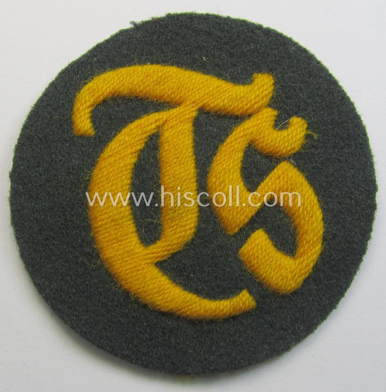 WH (Heeres) hand-embroidered, trade- and/or special-career insignia (ie. 'Tätigkeitsabzeichen') as executed on a darker-green-coloured background as was specifically intended for a: 'Truppensattlermeister'