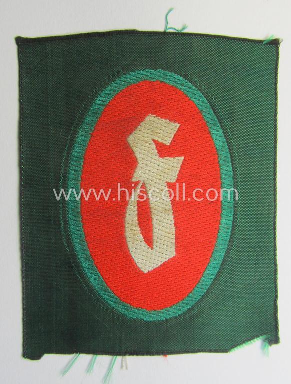 'Sicherheits- u. Hilfsdienst (SHD)' armbadge (ie. 'Ärmelabzeichen') as executed in 'BeVo'-weave pattern, as was intended for an SHD-member who served within the: 'Feuerlöschdienst' (or: fire-extinction-service)