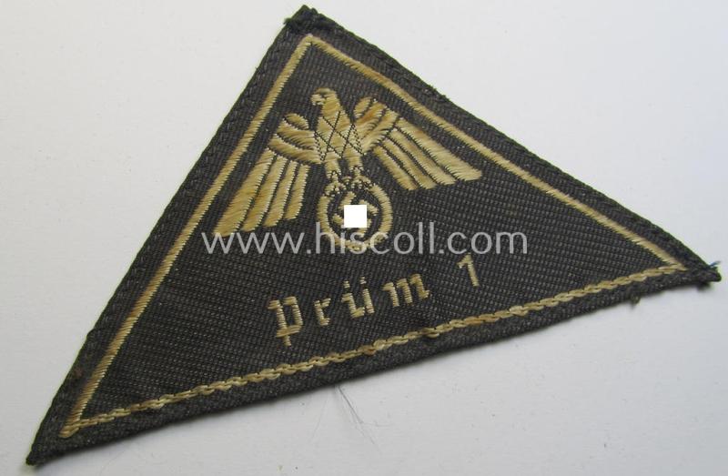 German Red Cross (ie. 'Deutsches Rotes Kreuz' or 'DRK') related, EM- (ie. NCO-) type, greyish-coloured- and/or (typically) triangular-shaped arm-eagle as executed in the neat 'BeVo'-weave pattern entitled: 'Prüm 1'