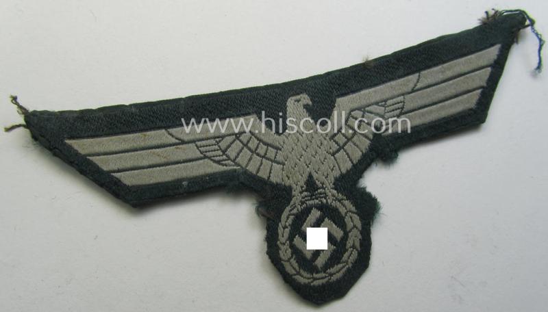 Clearly tunic-removed WH (Heeres) early- (ie. pre)-war-period- and/or greyish-coloured breast-eagle of the so-called: 'M36- (ie. M40-) pattern' (ie. 'Brustadler für Mannschaften u. Uffz.') as was executed in the neat 'BeVo'-weave pattern