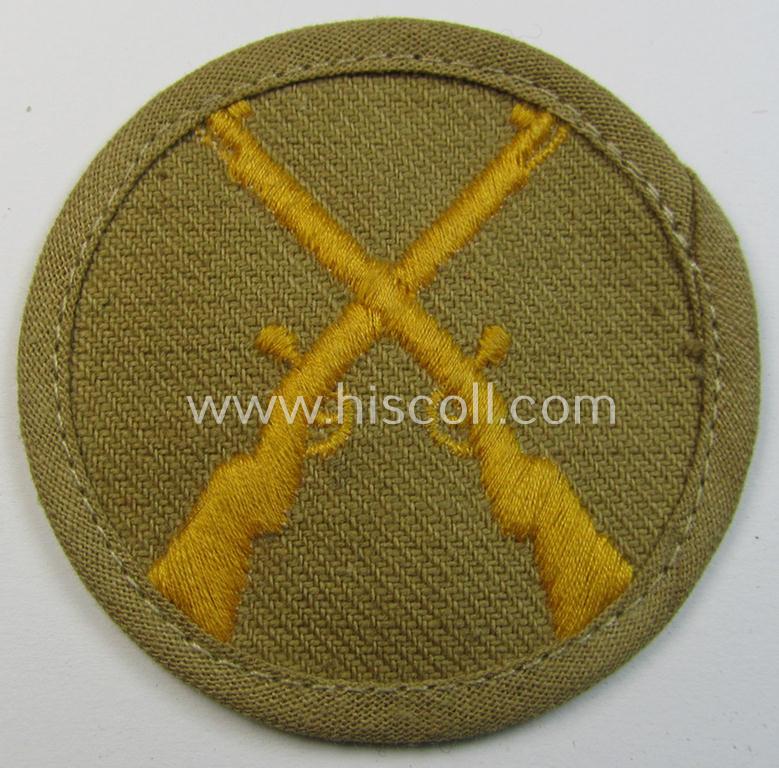 WH (Heeres) 'tropical'-issue, trade- and/or special-career insignia (ie. machine-embroidered 'Laufbahn- o. Tätigkeitsabzeichen') as was intended for an army: 'Waffenmeister' (or weapon-equipment NCO)