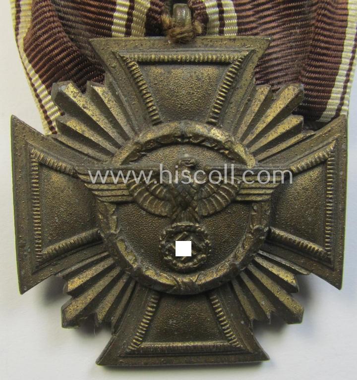 'N.S.D.A.P. DA in Bronze' (ie. '3. Stufe für 10 Jahre t.D.') being a 'regular-weight'-pattern, zinc- (ie. 'Feinzink'-) based example that comes mounted as a so-called: 'Einzelspange'