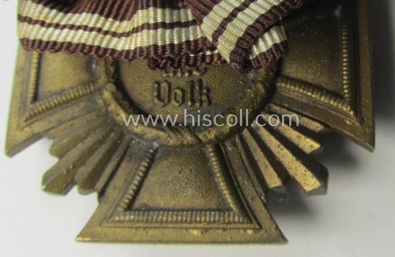 'N.S.D.A.P. DA in Bronze' (ie. '3. Stufe für 10 Jahre t.D.') being a 'regular-weight'-pattern, zinc- (ie. 'Feinzink'-) based example that comes mounted as a so-called: 'Einzelspange'