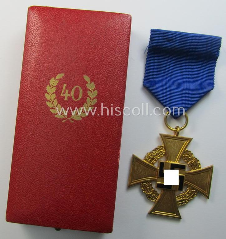 Attractive, 'Treuedienst Ehrenzeichen 1. Klasse' being a (typical) non-maker-marked example that came mounted onto its original ribbon (ie. 'Bandabschnitt') and that comes stored in its maker- (ie. 'Deschler'-) marked etui as issued