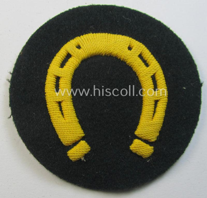 WH (Heeres) so-called: trade- and/or special-career arm-insignia (ie. 'Laufbahn- o. Tätigkeitsabzeichen') as was specifically intended for an army: 'Hufbeschlagmeister' (or farrier) being a neatly hand-embroidered variant on darker-green-coloured wool