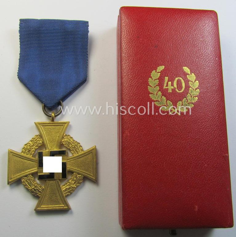 'Treuedienst Ehrenzeichen 1. Klasse' being a (typical) non-maker-marked example that came mounted onto its original ribbon (ie. 'Bandabschnitt') and that comes stored in its equally non-maker-marked etui as issued