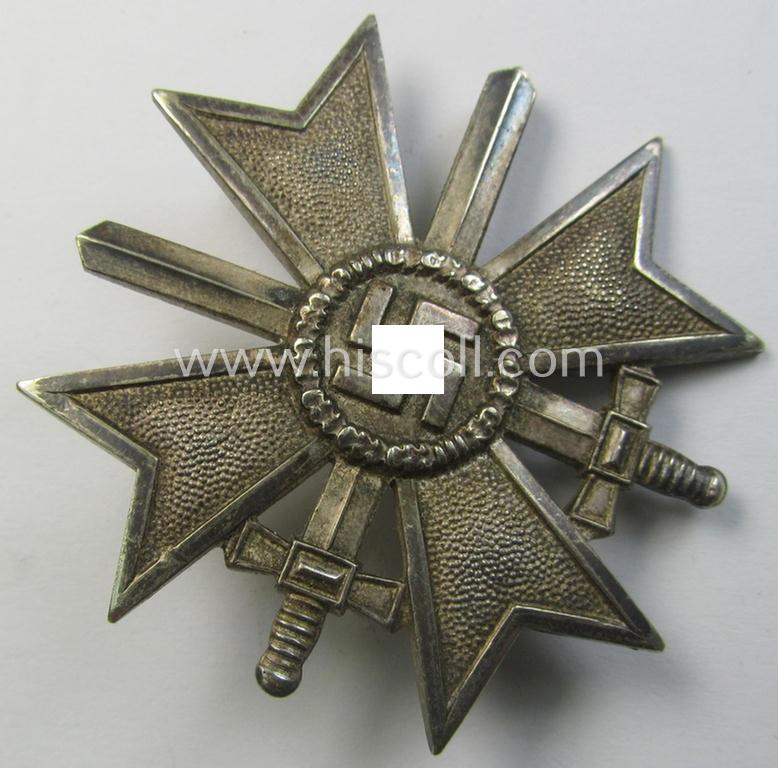 Attractive - and just moderately used- ie. worn! - 'Kriegsverdienstkreuz 1. Klasse mit Schwertern' being a non-maker-marked specimen that is executed in typical, silverish-coloured metal (ie. 'Buntmetall')