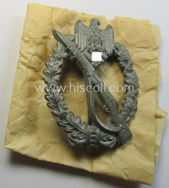 Attractive, 'Infanterie Sturmabzeichen in Silber', being an unmarked (and/or converse- ie. vaulted-) 'hollow-back' example by the maker: 'Friedrich Linden' (ie. 'F.L.L.') as executed in greyish-silver-coloured, zinc-based metal (ie. 'Feinzink')