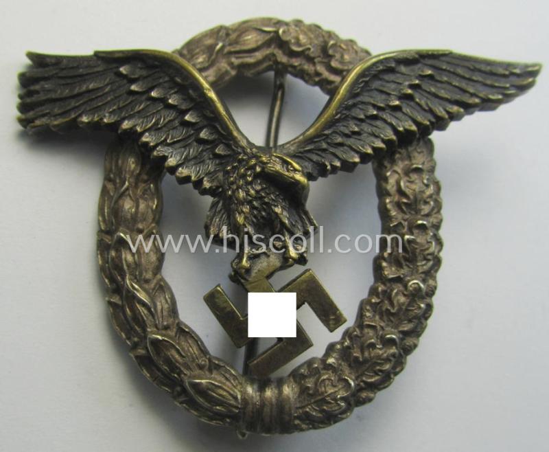 Early- (ie. pre-) war-period- and/or: 'Buntmetall'- (ie. 'Tombak'-) based: WH (Luftwaffe) 'Flugzeugführerabzeichen' (or: pilots-badge) being a clearly maker- (ie. 'C.E. Juncker'-) marked example of the 'J2'-pattern