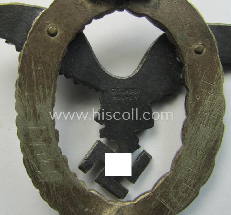 Early- (ie. pre-) war-period- and/or: 'Buntmetall'- (ie. 'Tombak'-) based: WH (Luftwaffe) 'Flugzeugführerabzeichen' (or: pilots-badge) being a clearly maker- (ie. 'C.E. Juncker'-) marked example of the 'J2'-pattern
