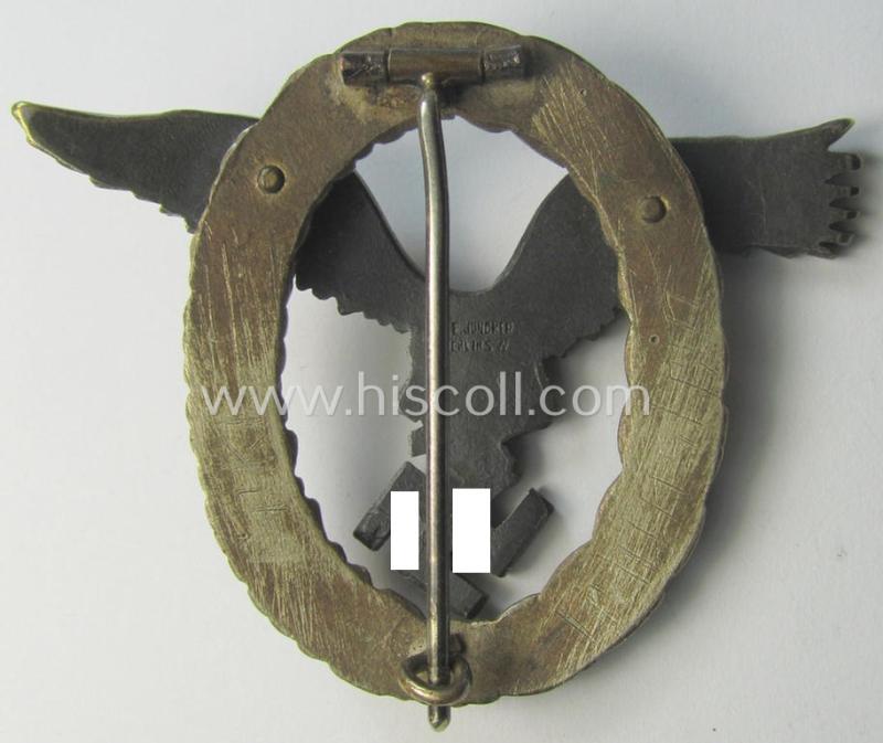 Early- (ie. pre-) war-period- and/or: 'Buntmetall'- (ie. 'Tombak'-) based: WH (Luftwaffe) 'Flugzeugführerabzeichen' (or: pilots-badge) being a clearly maker- (ie. 'C.E. Juncker'-) marked example of the 'J2'-pattern
